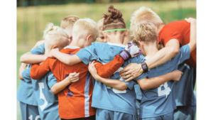 soccer kids in a huddle